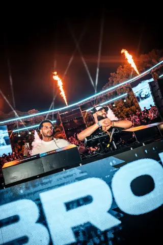 The Martinez Brothers in the booth with flames and the BRO sign. MAPPA 06 (Water), Tenerife, July 2026. Photo for Just Music.